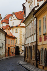 Fototapeta na wymiar A traditional street of Prague, the capital of the Czech Republic, with typically gingerbread and very elegant houses of different colors, than Prague is known for, except for its Gothic architecture