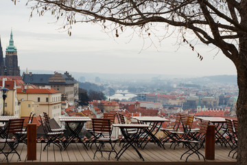 Panoramic view of Prague, the capital of the Czech Republic, and the Vltava river, traditional red rooftops from one of the Prague hills in late autumn