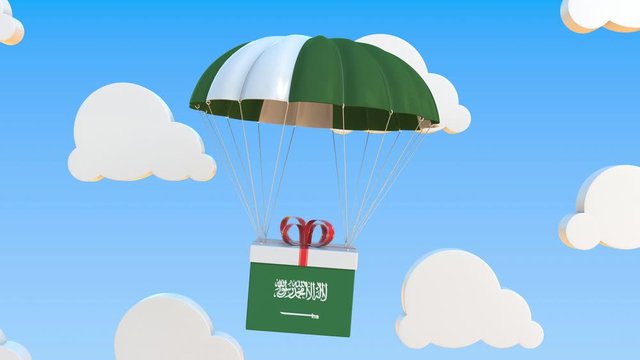 Box with national flag of Saudi Arabia falls with a parachute. Loopable conceptual 3D animation