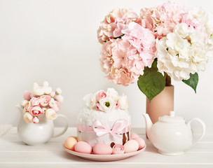 Easter orthodox sweet bread, kulich and colorful eggs with flowers. Holidays breakfast concept with copy space. Retro style. Easter greeting card template
