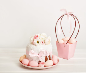 Easter orthodox sweet bread, kulich and colorful eggs with flowers. Holidays breakfast concept with copy space. Retro style. Easter greeting card template