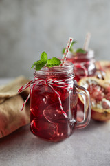 Pomegranate juice in jar with handle. .