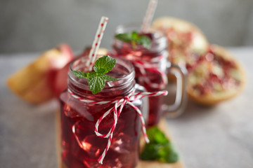 Pomegranate juice in jar with handle. .