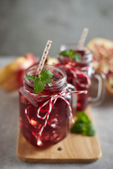 Pomegranate juice in jar with handle. .