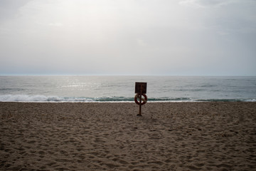 Life Preserver on Empty Beach