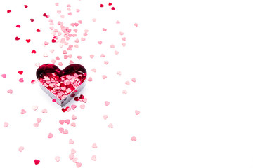Background with red hearts on light. The concept of Valentine's day.