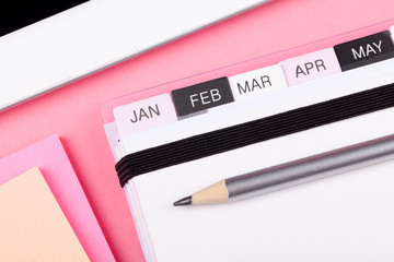 Pink calendar with months from January - April 