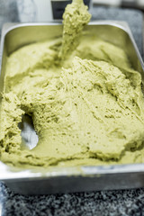 pistachio paste macro detailed texture.Blurred image. Components for cooking