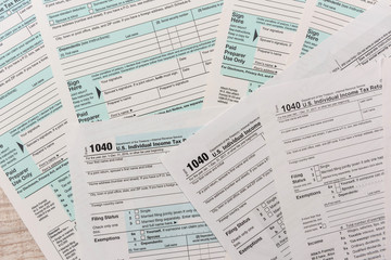 many 1040 tax form. Tax concept.