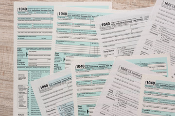 many 1040 tax form. Tax concept.