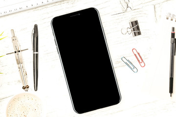 iPhone X on desk top view