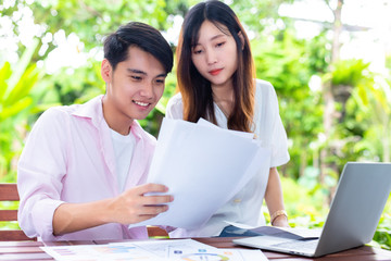 Young start up business couple working at home