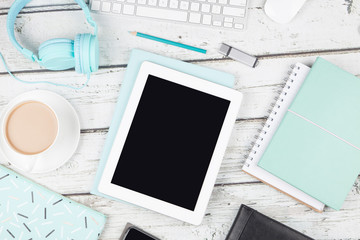 Digital device on white wood table 