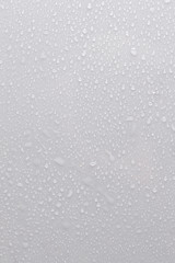 drops of water on a white surface