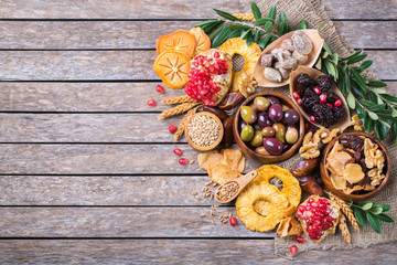 Tu Bishvat holiday symbols - dried fruits, pomegranate, barley, wheat