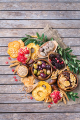 Tu Bishvat holiday symbols - dried fruits, pomegranate, barley, wheat