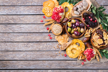 Tu Bishvat holiday symbols - dried fruits, pomegranate, barley, wheat