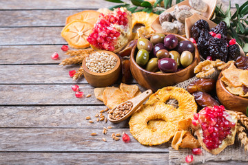 Tu Bishvat holiday symbols - dried fruits, pomegranate, barley, wheat
