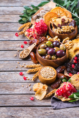 Tu Bishvat holiday symbols - dried fruits, pomegranate, barley, wheat