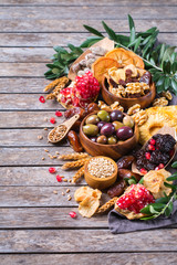 Tu Bishvat holiday symbols - dried fruits, pomegranate, barley, wheat