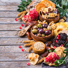 Tu Bishvat holiday symbols - dried fruits, pomegranate, barley, wheat