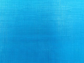 Photo background with bright blue embossed cardboard texture.