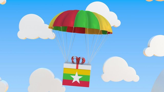 Carton with flag of Myanmar falls with a parachute. Loopable conceptual 3D animation
