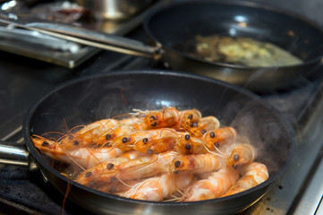 cooking shrimp cocktail with sauce in a restaurant, ready meal