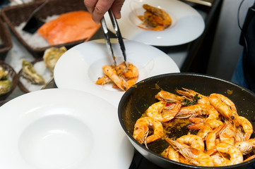 cooking shrimp cocktail with sauce in a restaurant, ready meal