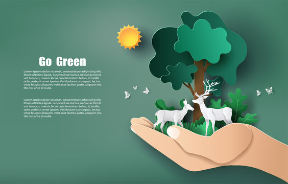 Paper art style of hand holding tree and plants with deers, save the planet and energy concept.