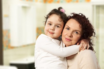 Obraz premium Beautiful smiling family on interior background