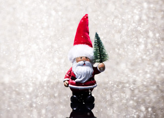 Santa Claus with a Christmas tree. Christmas greeting card