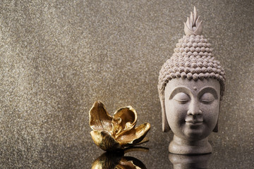 Buddha head statue and golden orchid flower. Zen Meditation Background