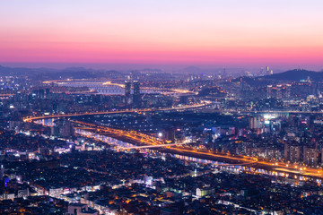 Seoul City and skyline with skyscrapers in Sunset, Han river in Aerial view of Yongma Mountain or Yongmasan