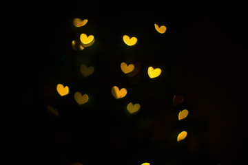 Yellow hearts bokeh background. Valentine’s Day, symbol of love.