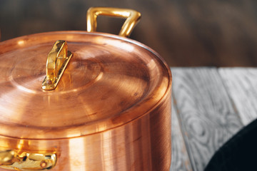 Close up of a set of copper cookware