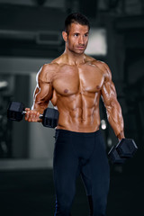 Naklejka na ściany i meble Muscular Men, Bodybuilder Lifting Weights in the Gym