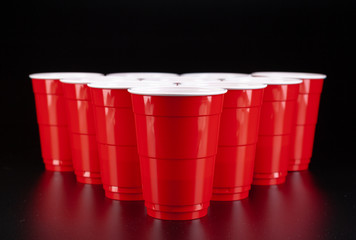 The arrangement of red plastic cups for game of beer pong