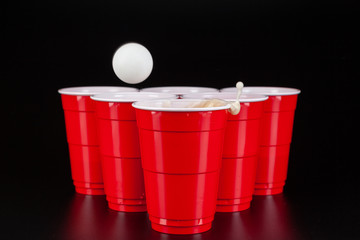 The arrangement of red plastic cups for game of beer pong