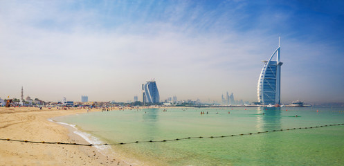 DUBAI, UAE - MARCH 30, 2017: The evening skyline with the Burj al Arab and Jumeirah Beach Hotels and the open Jumeriah beach.