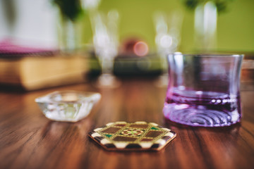 arabic coaster on a elegant wooden table
