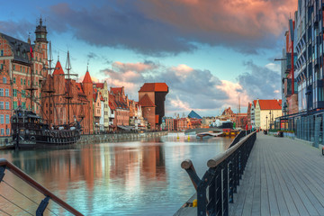 Fototapeta premium Beautiful scenery of the old town in Gdansk over Motlawa river at sunrise, Poland.