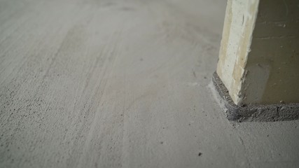 The result is finished flooring work with mortar. The status of the results of the process of interior decoration of the floors of the premises. Floor repair