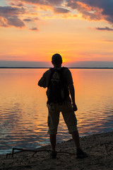 Fototapeta premium Silhouettes of tourists and a beautiful landscape
