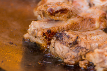 The meat is cooked in a cauldron