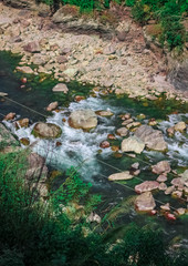 Water running over brown rocks