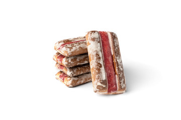 Traditional Russian gingerbread with cherry or raspberry filling isolated on white background.