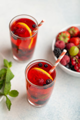 Fresh summer berry drink with lemon and mint.