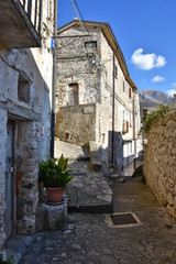 Fototapeta na wymiar Prata Sannita, Italy, 01/13/2020. A narrow street between the old houses of a medieval village