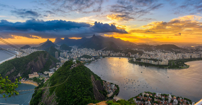 Sunset view of Copacabana, Corcovado, Flamengo, Botafogo and Centro in Rio de Janeiro, Brazil. Panorama of Rio de Janeiro and Guanabara bay. Skyline of Rio de Janeiro